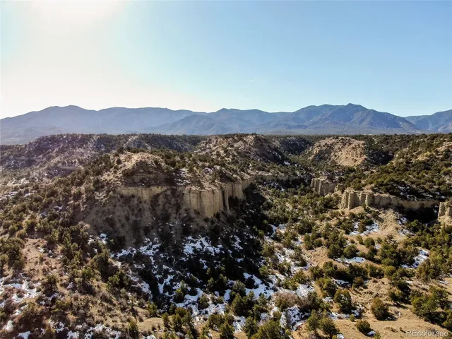 a view of a city with mountains in the background