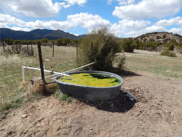 a view of a swimming pool with a yard