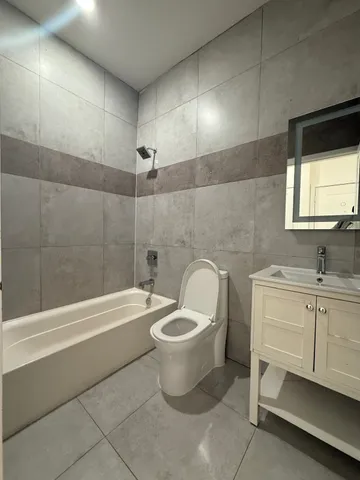 a bathroom with a toilet sink and bathtub