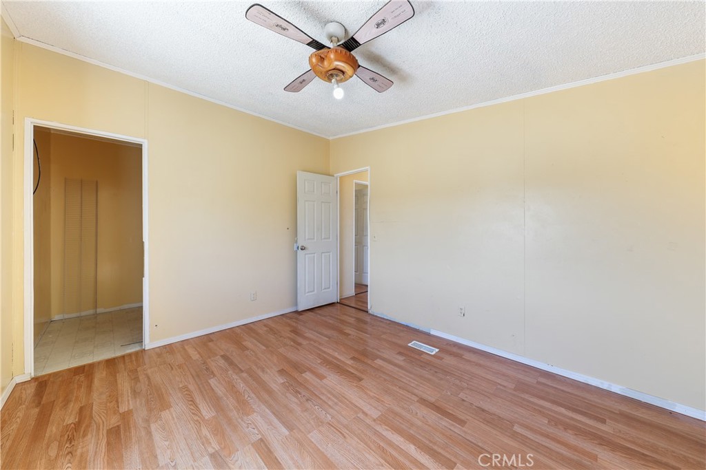 8195 Alta Mesa Road Oak Hills, CA 92344 - Photo 15 of 33 a view of empty room with wooden floor