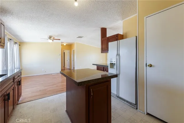 a kitchen with a refrigerator and countertop