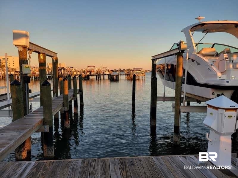 27580 Canal Road, Unit 1431 Orange Beach, AL 36561 - Photo 48 of 73 Dock with a water view and boat lift