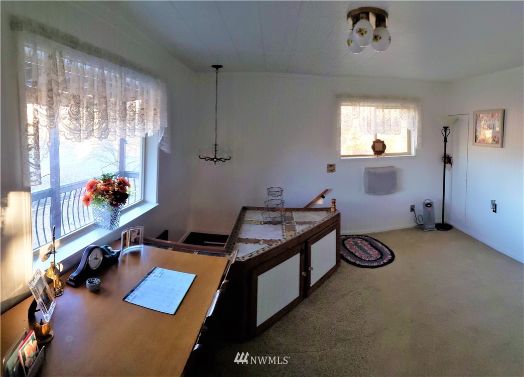 49 Sand Flat Road Omak, WA 98841 - Photo 27 of 40 a room with furniture and a window