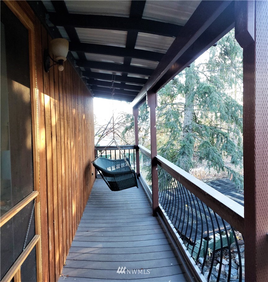 49 Sand Flat Road Omak, WA 98841 - Photo 29 of 40 a view of a balcony with wooden floor