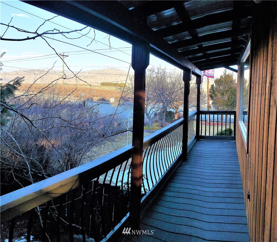 49 Sand Flat Road Omak, WA 98841 - Photo 30 of 40 a view of balcony with wooden floor