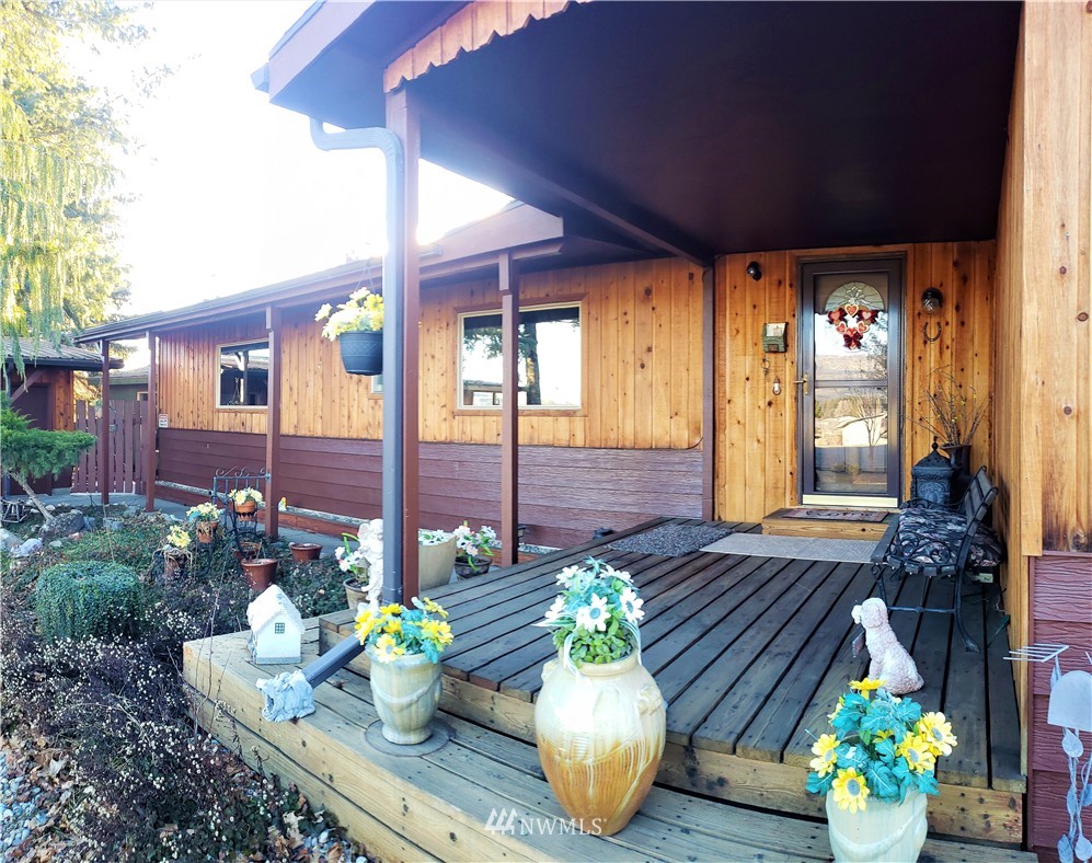 49 Sand Flat Road Omak, WA 98841 - Photo 4 of 40 a view of an outdoor dining space with a table and chairs