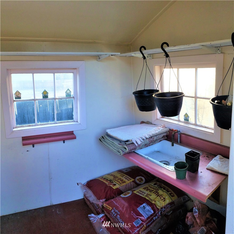 49 Sand Flat Road Omak, WA 98841 - Photo 35 of 40 a bedroom with a bed and a window