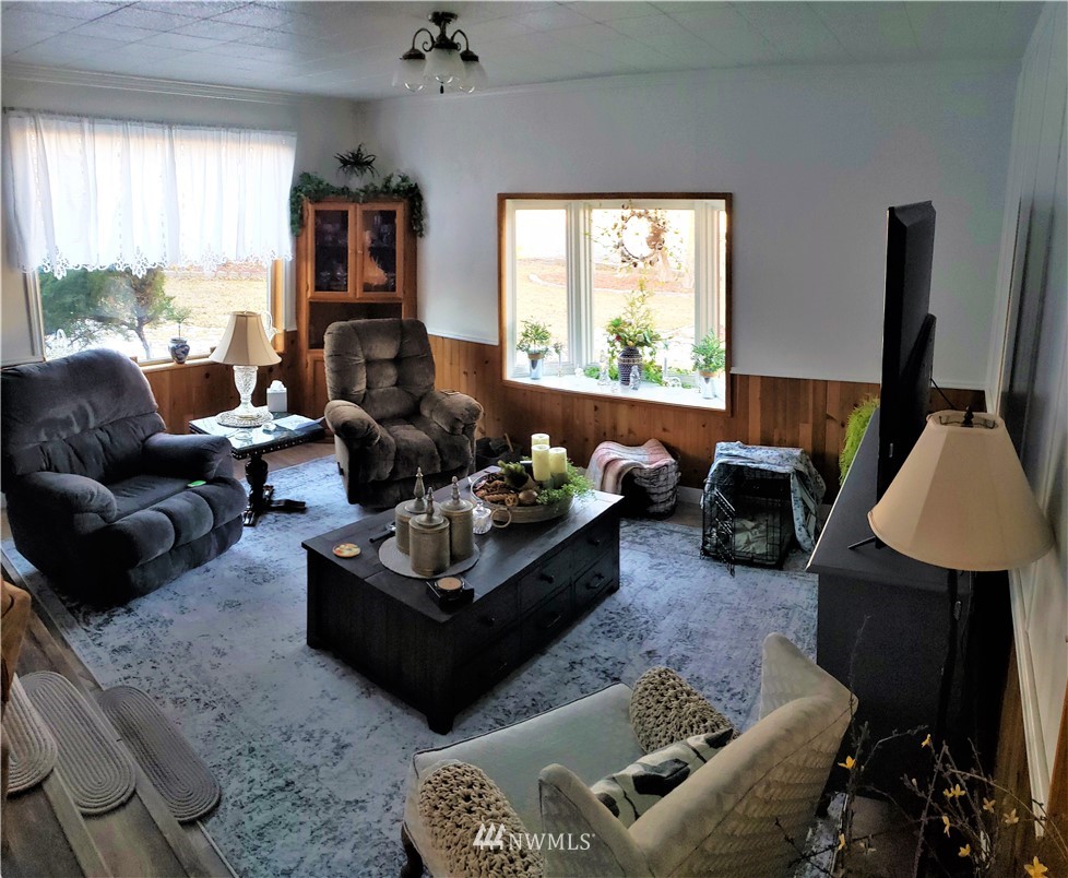 49 Sand Flat Road Omak, WA 98841 - Photo 6 of 40 a living room with furniture window and a flat screen tv