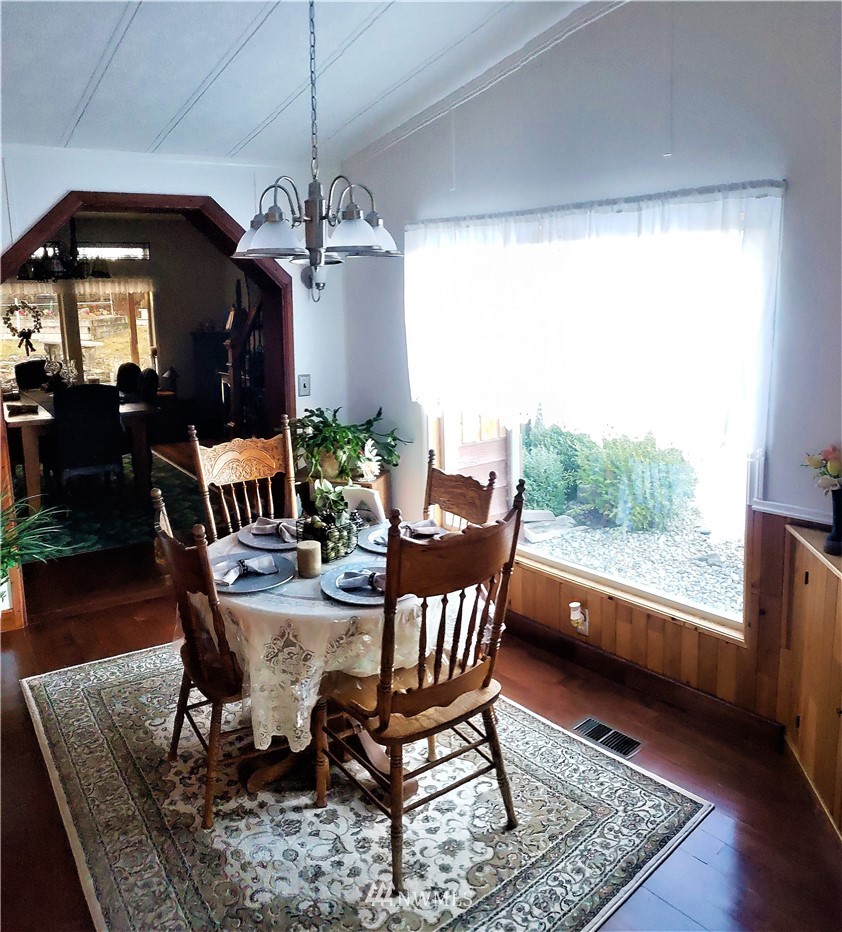 49 Sand Flat Road Omak, WA 98841 - Photo 10 of 40 a view of a dining room with furniture window and wooden floor