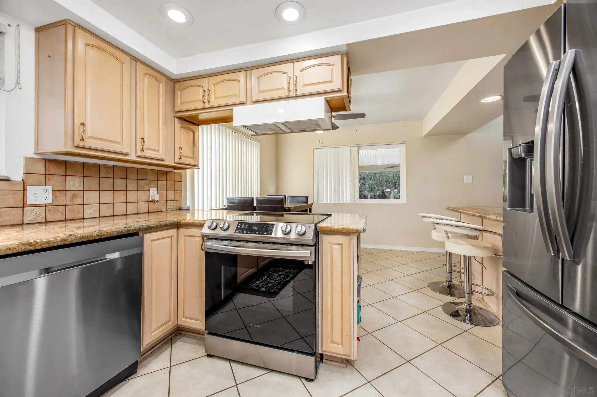 1673 Hidden Mesa Road El Cajon, CA 92019 - Photo 21 of 29 a kitchen with a sink cabinets and stainless steel appliances