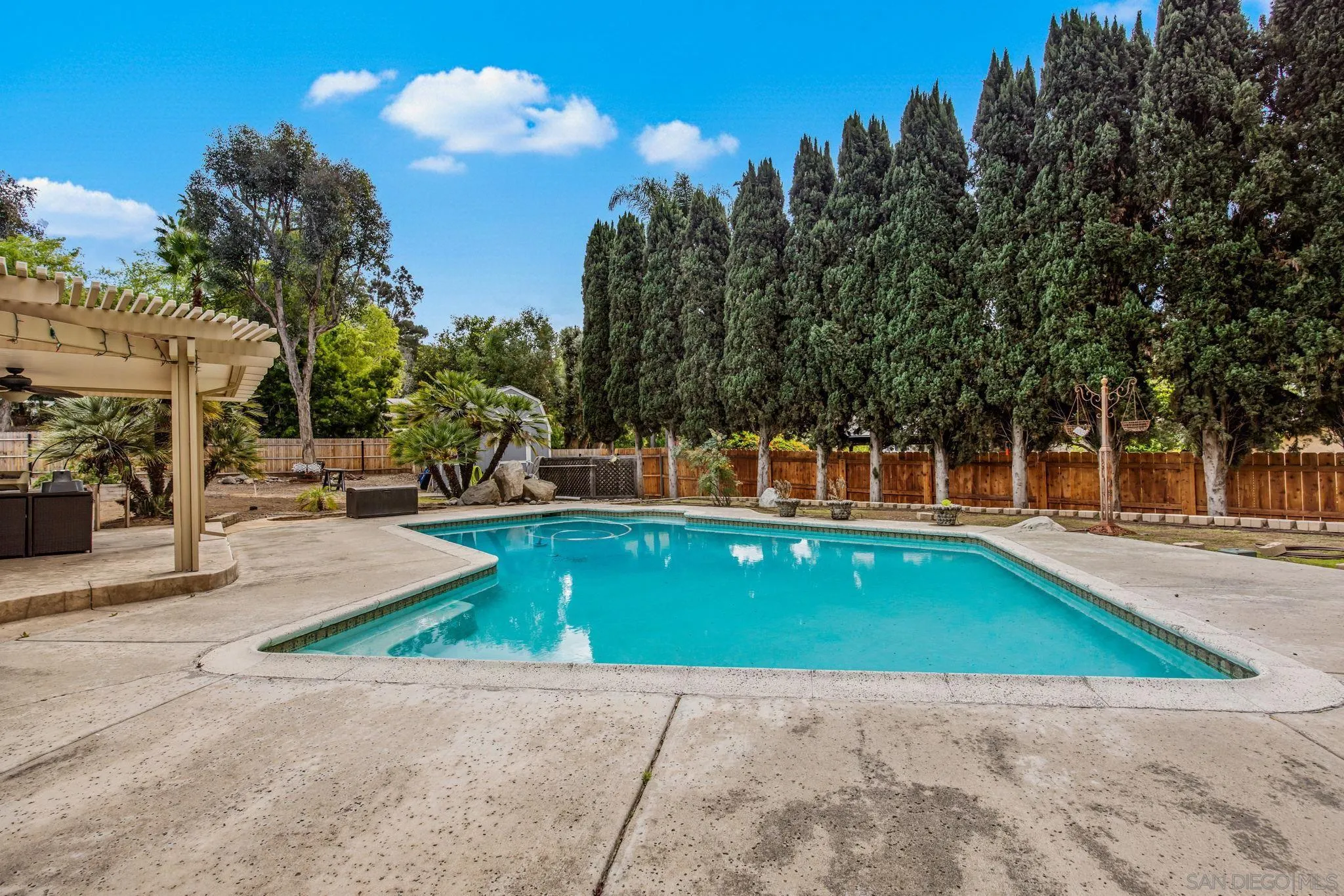 1673 Hidden Mesa Road El Cajon, CA 92019 - Photo 9 of 29 a view of a swimming pool with an outdoor space and seating area
