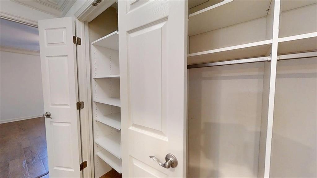 300 Johnson Ferry Road, Unit B201 Atlanta, GA 30328 - Photo 20 of 32 a view of walk in closet with empty racks