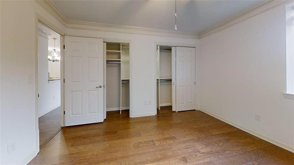 300 Johnson Ferry Road, Unit B201 Atlanta, GA 30328 - Photo 24 of 32 an empty room with wooden floor and closet