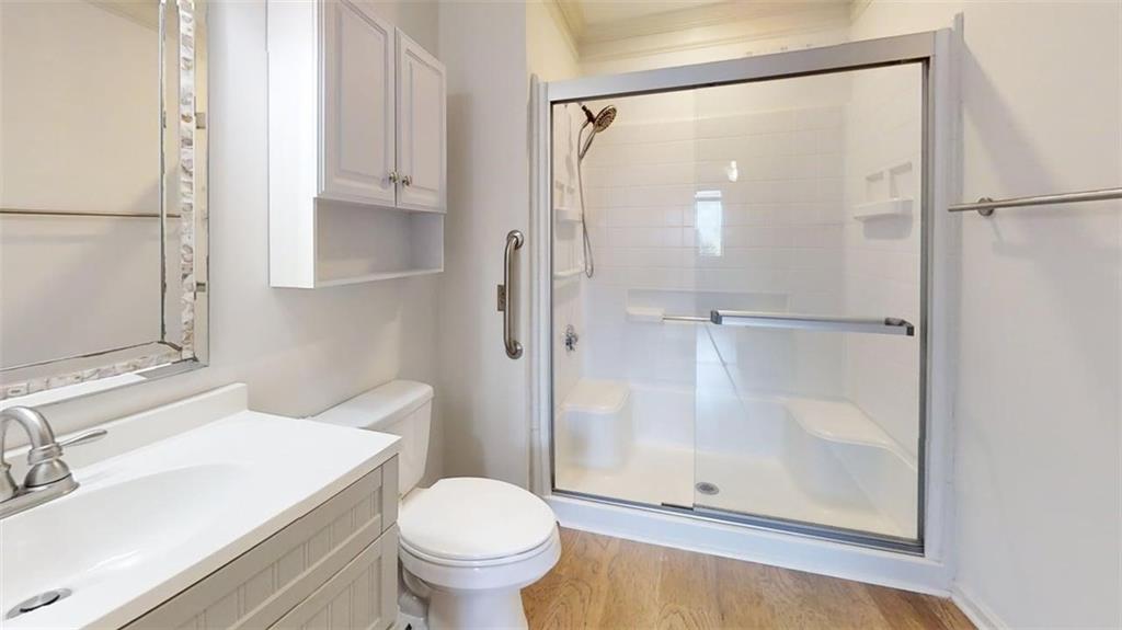 300 Johnson Ferry Road, Unit B201 Atlanta, GA 30328 - Photo 30 of 32 a bathroom with a sink toilet and shower