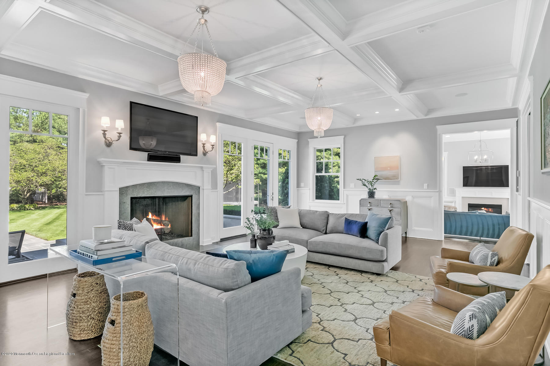 127 Ave Of Two Rivers Rumson, NJ 07760 - Photo 12 of 59 a living room with furniture a fireplace and a flat screen tv