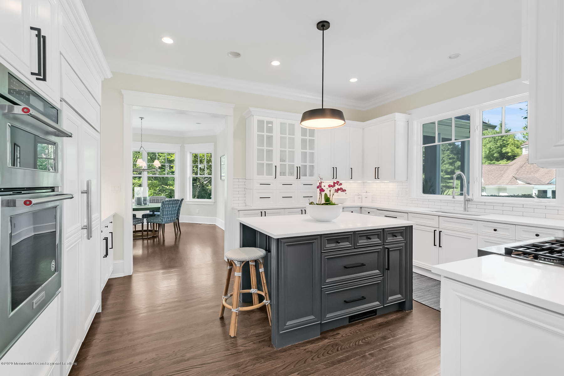 127 Ave Of Two Rivers Rumson, NJ 07760 - Photo 15 of 59 a kitchen with a stove a counter space a sink appliances and cabinets