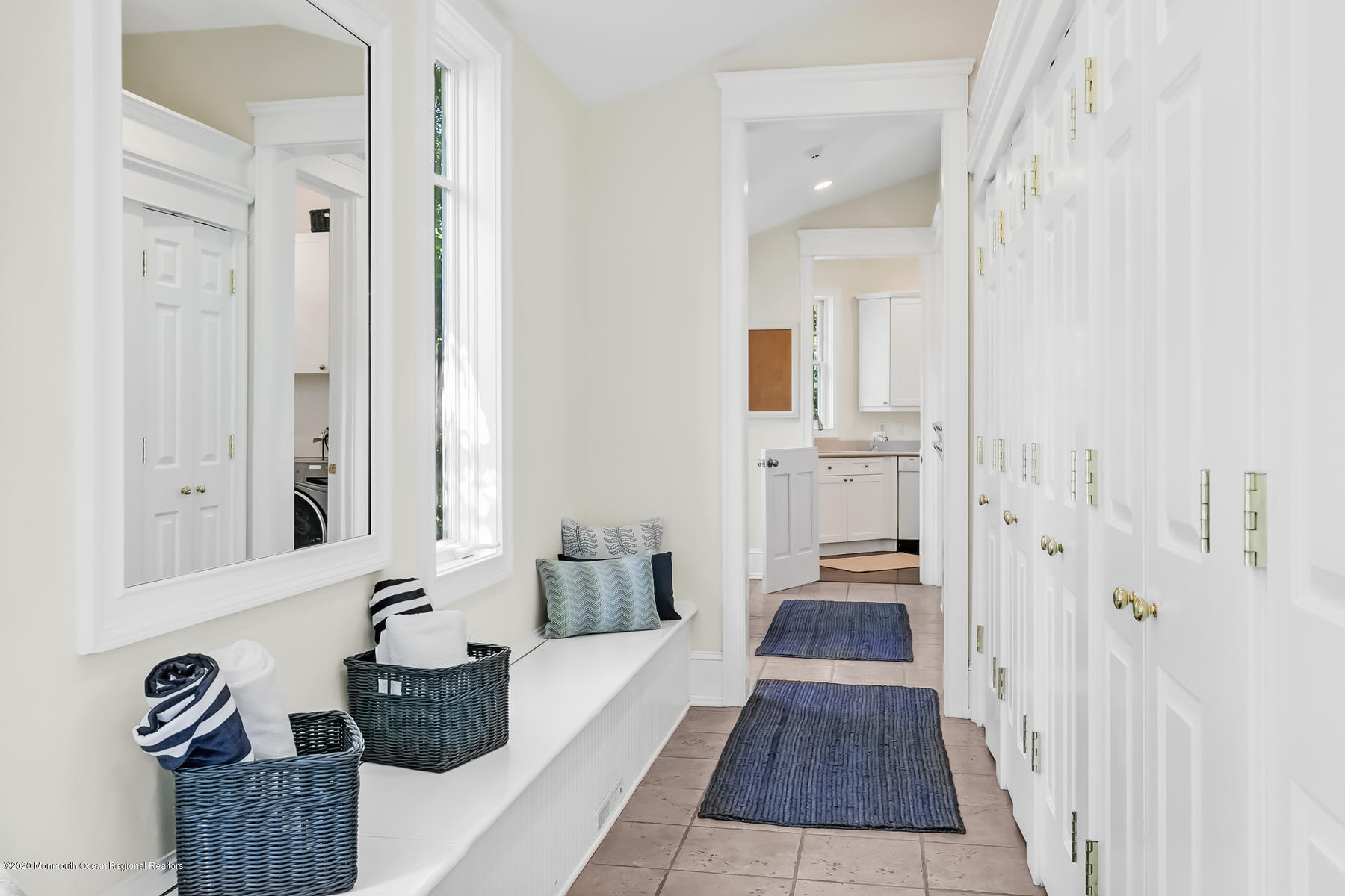 127 Ave Of Two Rivers Rumson, NJ 07760 - Photo 22 of 59 a hallway with white cabinets and wooden floor
