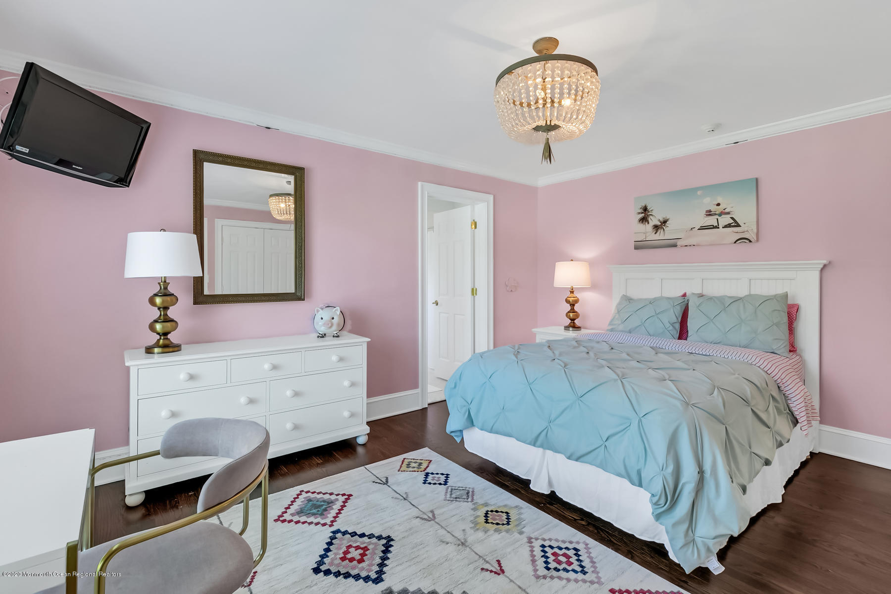127 Ave Of Two Rivers Rumson, NJ 07760 - Photo 35 of 59 a bedroom with a bed and a mirror on the dresser