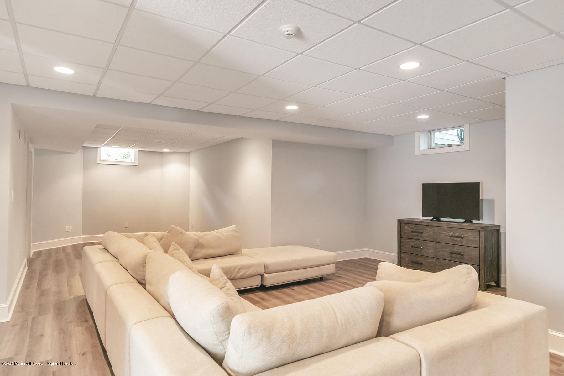 127 Ave Of Two Rivers Rumson, NJ 07760 - Photo 46 of 59 a living room with furniture and a flat screen tv