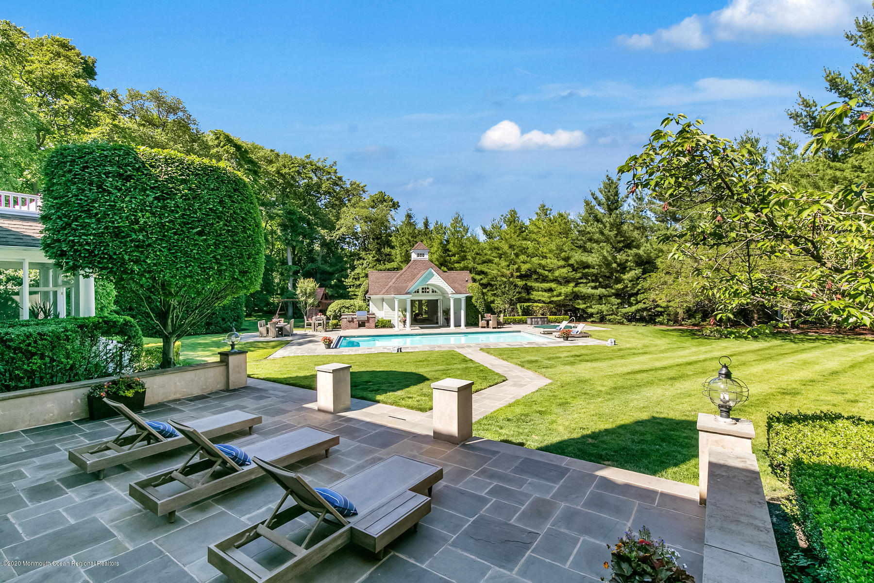 127 Ave Of Two Rivers Rumson, NJ 07760 - Photo 49 of 59 a view of a swimming pool with a lounge chairs