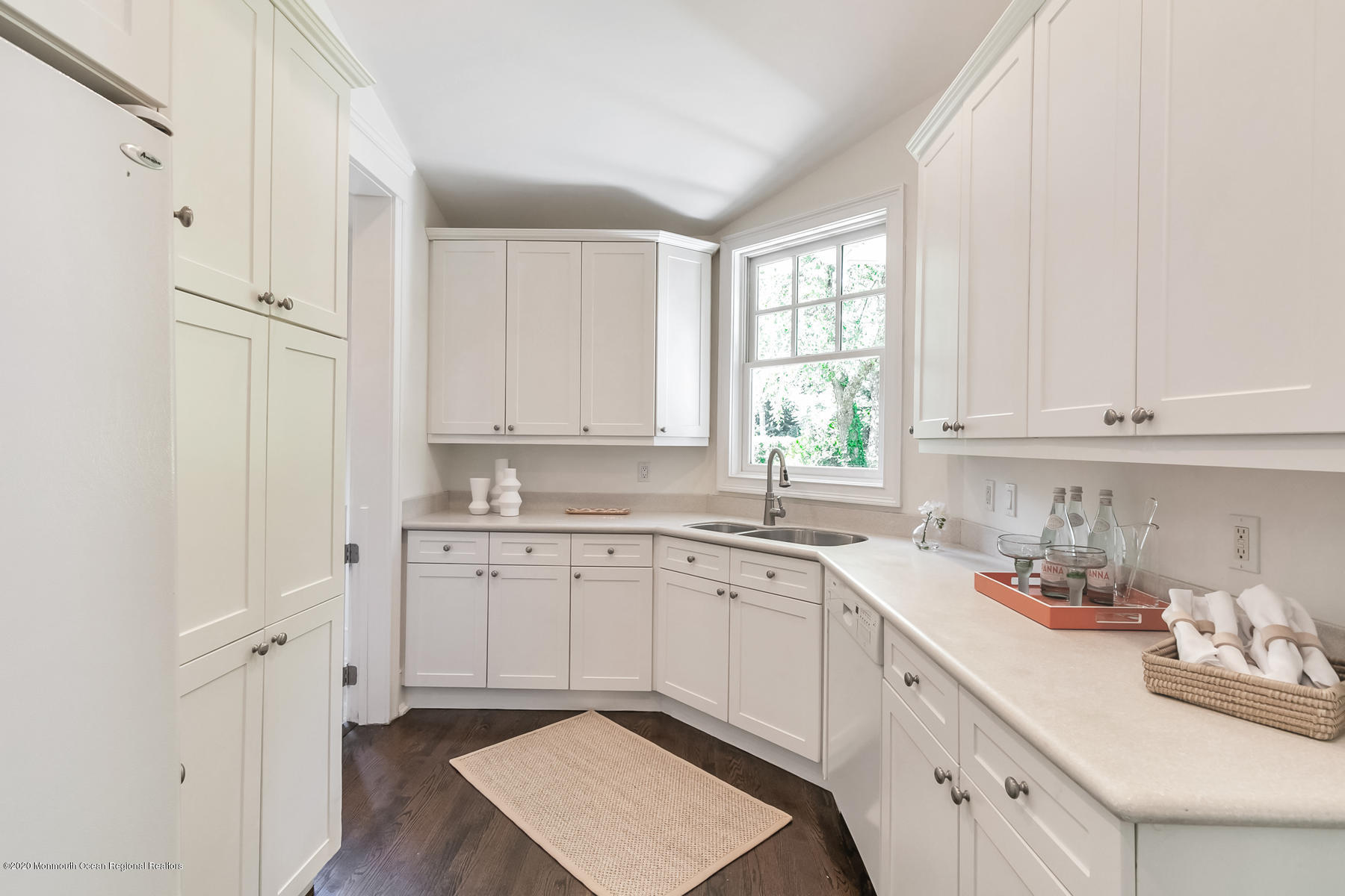 127 Ave Of Two Rivers Rumson, NJ 07760 - Photo 10 of 59 a kitchen with cabinets appliances and a window