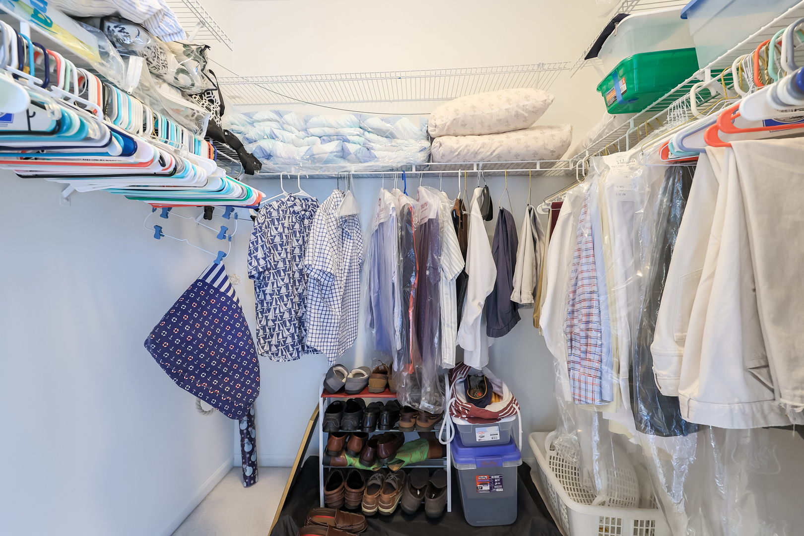 1472 Grand Haven Road Romeoville, IL 60446 - Photo 13 of 21 a view of walk in closet with clothes and shoes