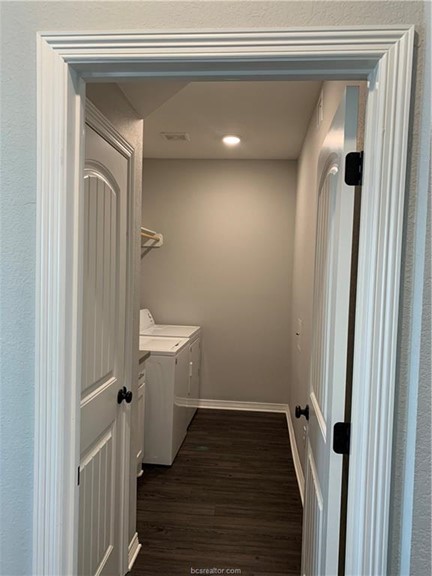 6939 Halter Loop College Station, TX 77845 - Photo 24 of 33 a view of a hallway with wooden floor and entryway