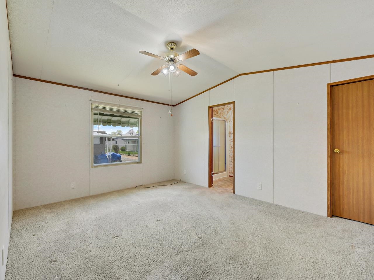 3195 F Road, Unit 22 Grand Junction, CO 81504 - Photo 11 of 24 a view of an empty room with a window