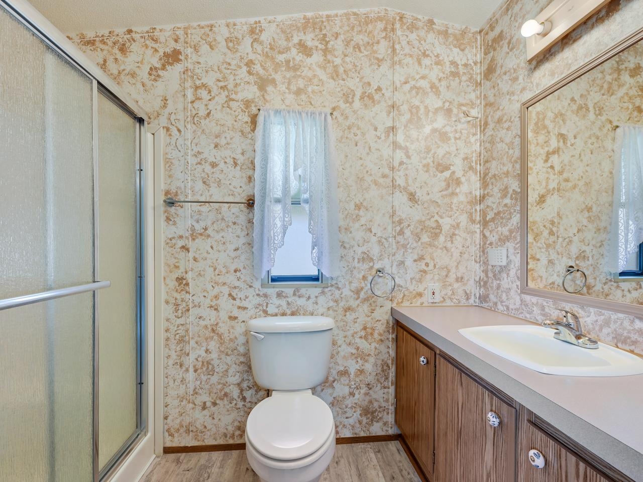 3195 F Road, Unit 22 Grand Junction, CO 81504 - Photo 13 of 24 a bathroom with a sink a toilet and shower