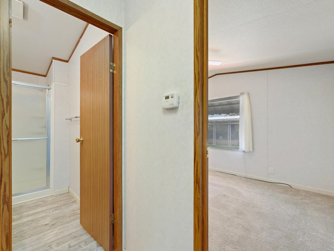 3195 F Road, Unit 22 Grand Junction, CO 81504 - Photo 14 of 24 a view of a bathroom with a glass door