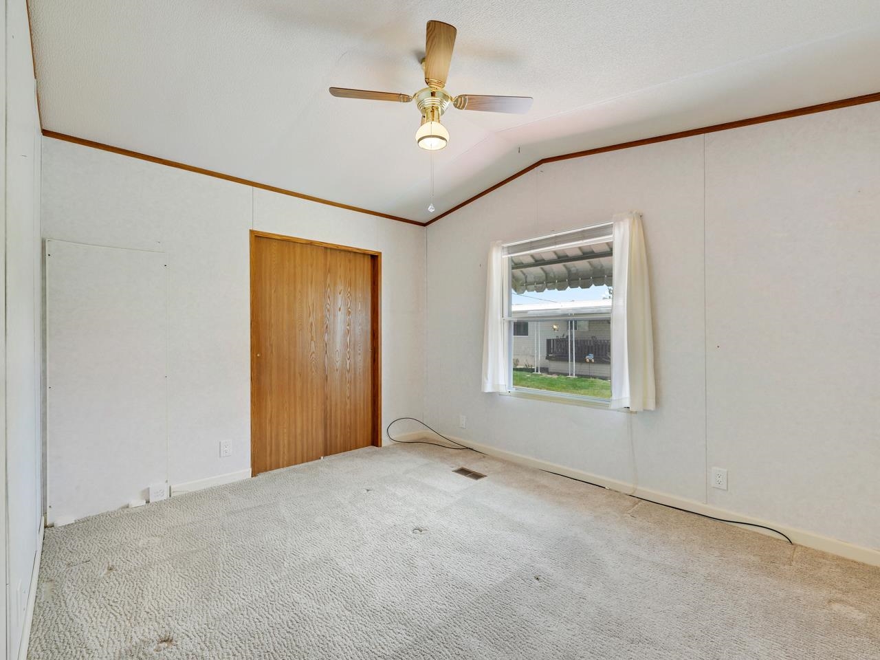 3195 F Road, Unit 22 Grand Junction, CO 81504 - Photo 15 of 24 a view of an empty room with a window