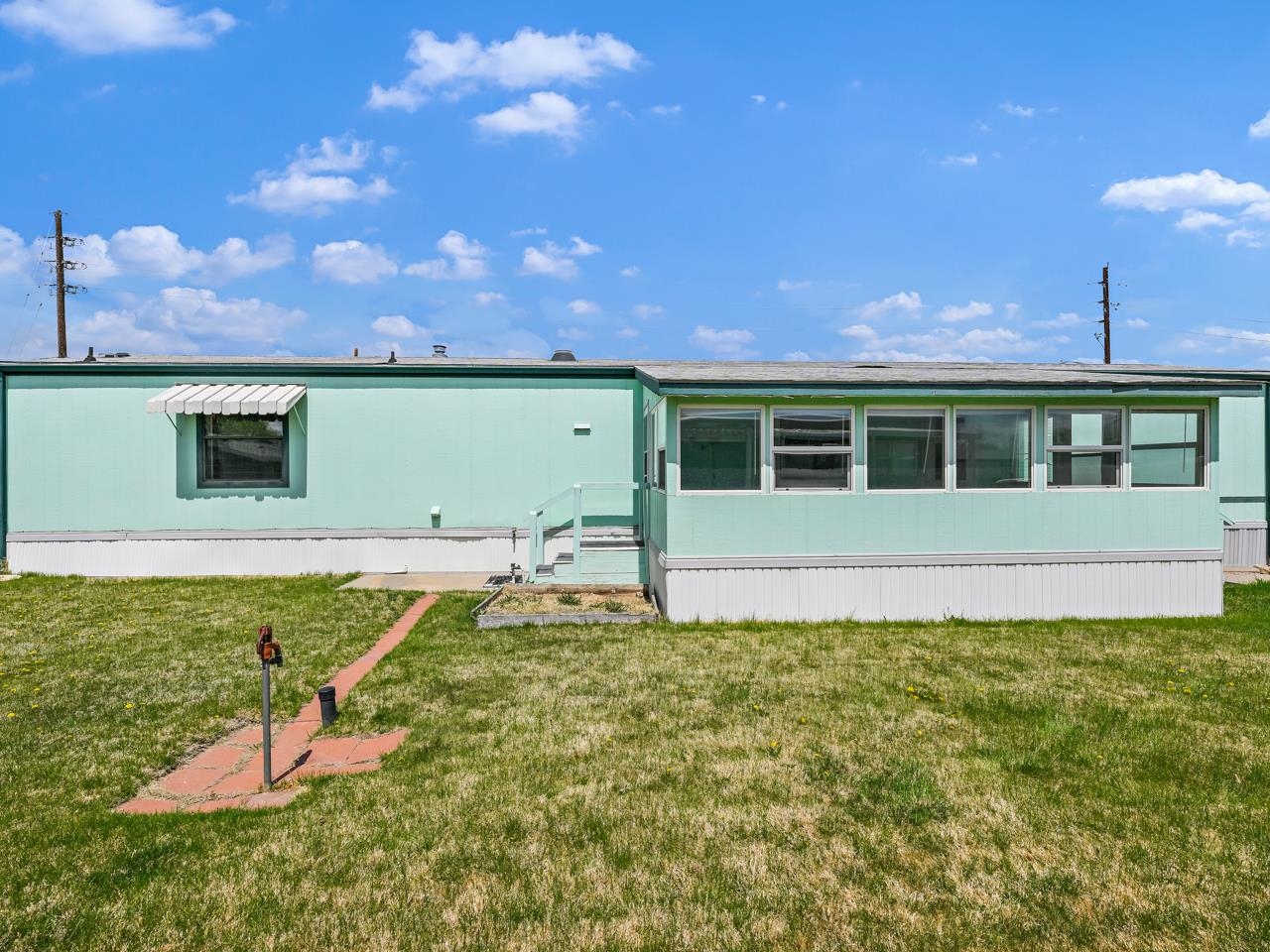 3195 F Road, Unit 22 Grand Junction, CO 81504 - Photo 22 of 24 a view of a house with a yard