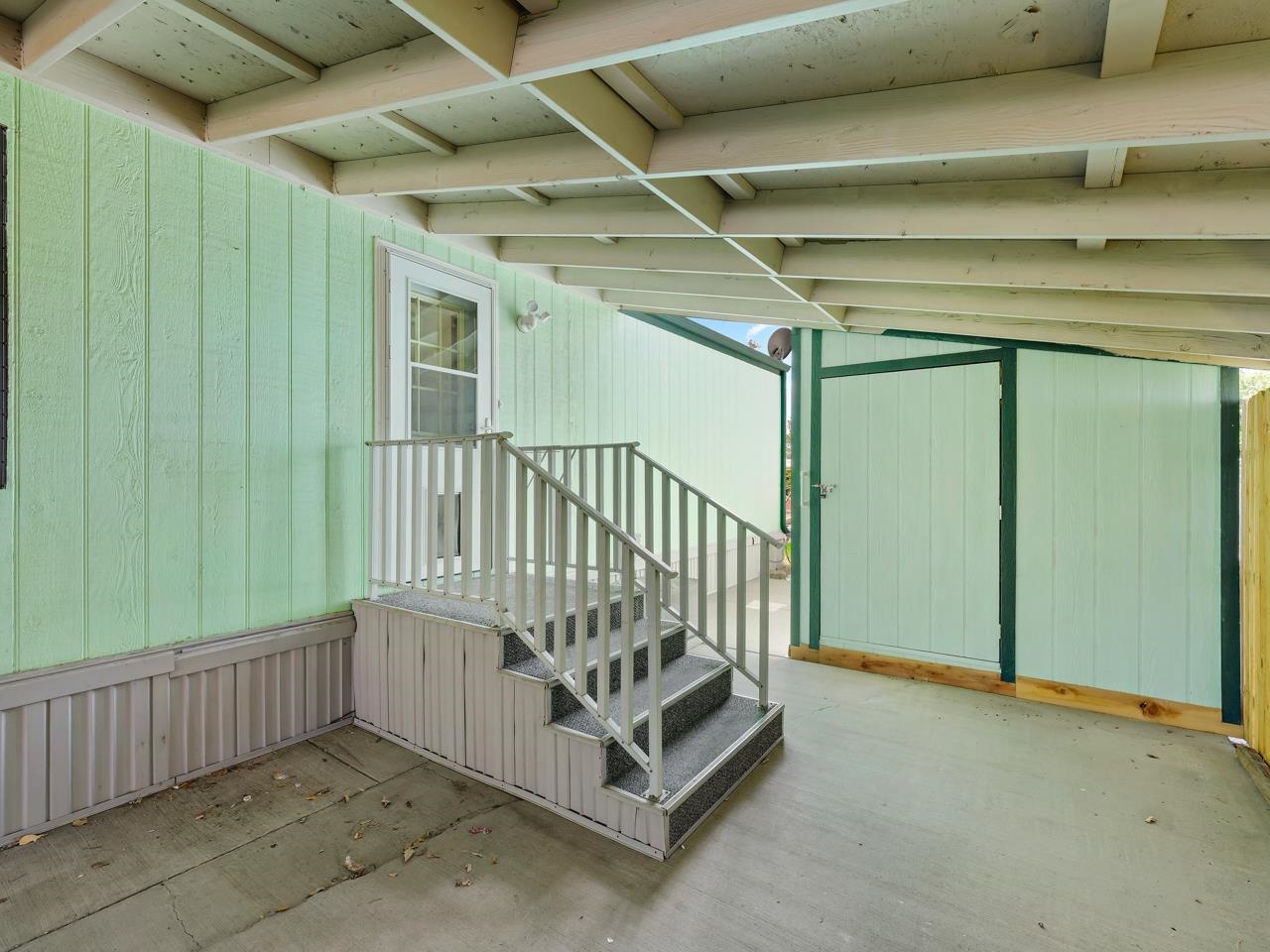 3195 F Road, Unit 22 Grand Junction, CO 81504 - Photo 3 of 24 a view of a porch with wooden floor
