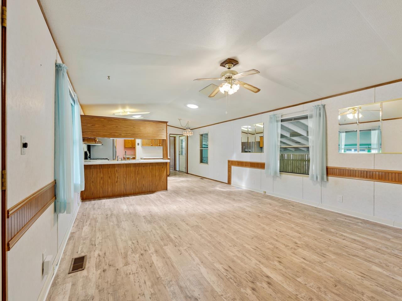3195 F Road, Unit 22 Grand Junction, CO 81504 - Photo 4 of 24 a view of an empty room with a window and fireplace