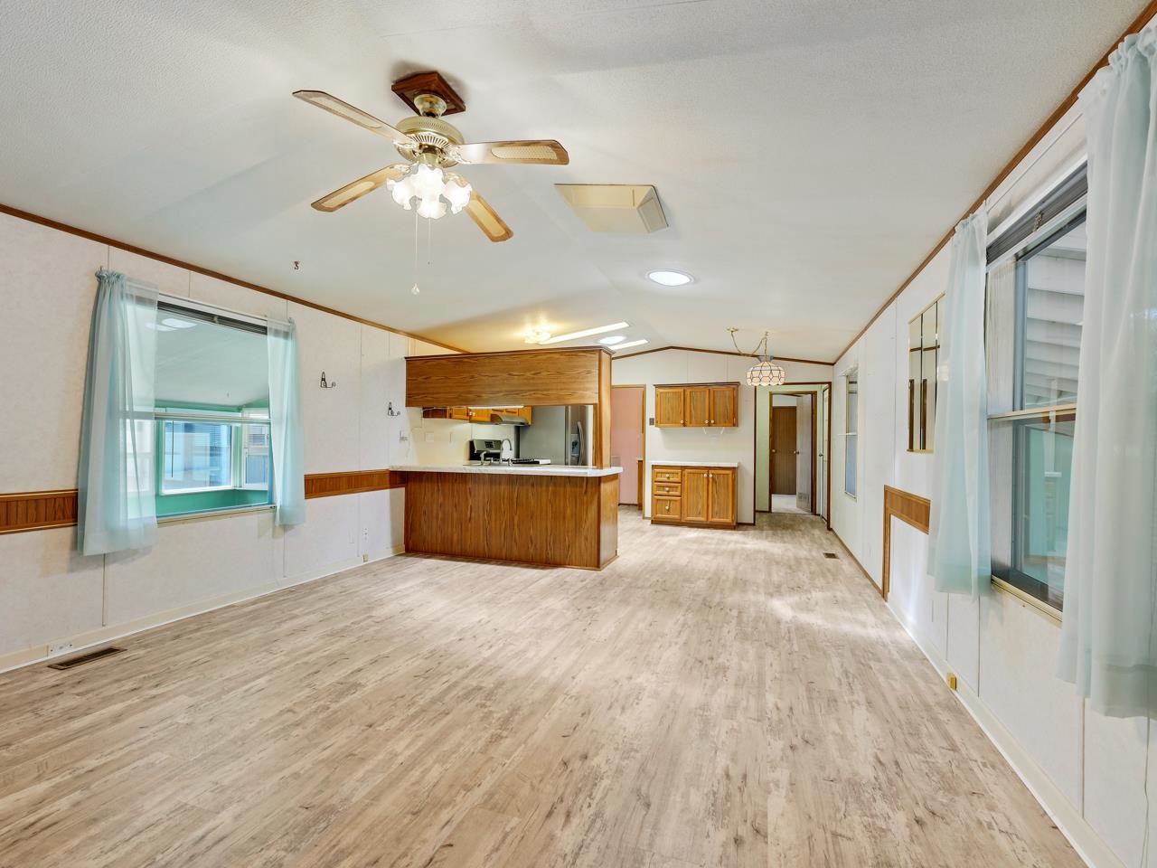 3195 F Road, Unit 22 Grand Junction, CO 81504 - Photo 5 of 24 a view of an empty room with window and cabinet