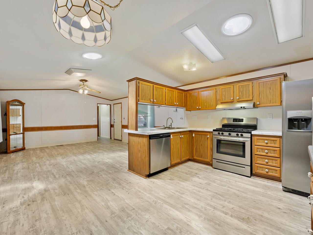 3195 F Road, Unit 22 Grand Junction, CO 81504 - Photo 8 of 24 a kitchen with granite countertop a stove and cabinets