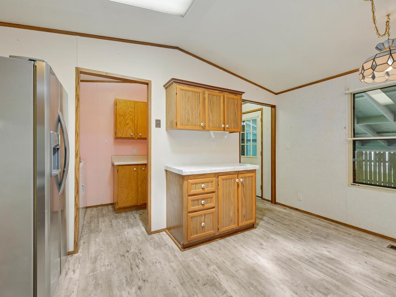 3195 F Road, Unit 22 Grand Junction, CO 81504 - Photo 10 of 24 a kitchen with stainless steel appliances granite countertop a refrigerator and a stove
