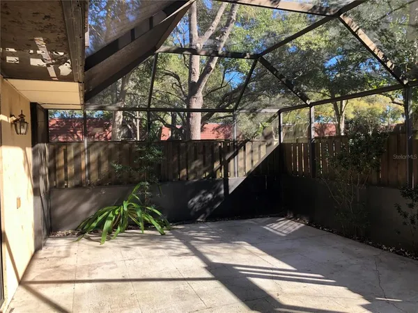 a view of street along with house and trees