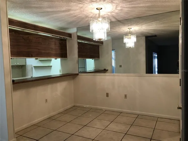a view of a bathroom with a sink and a mirror