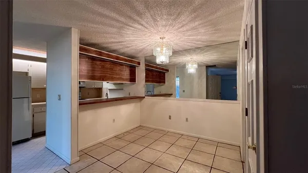 a kitchen with stainless steel appliances a refrigerator and a stove top oven