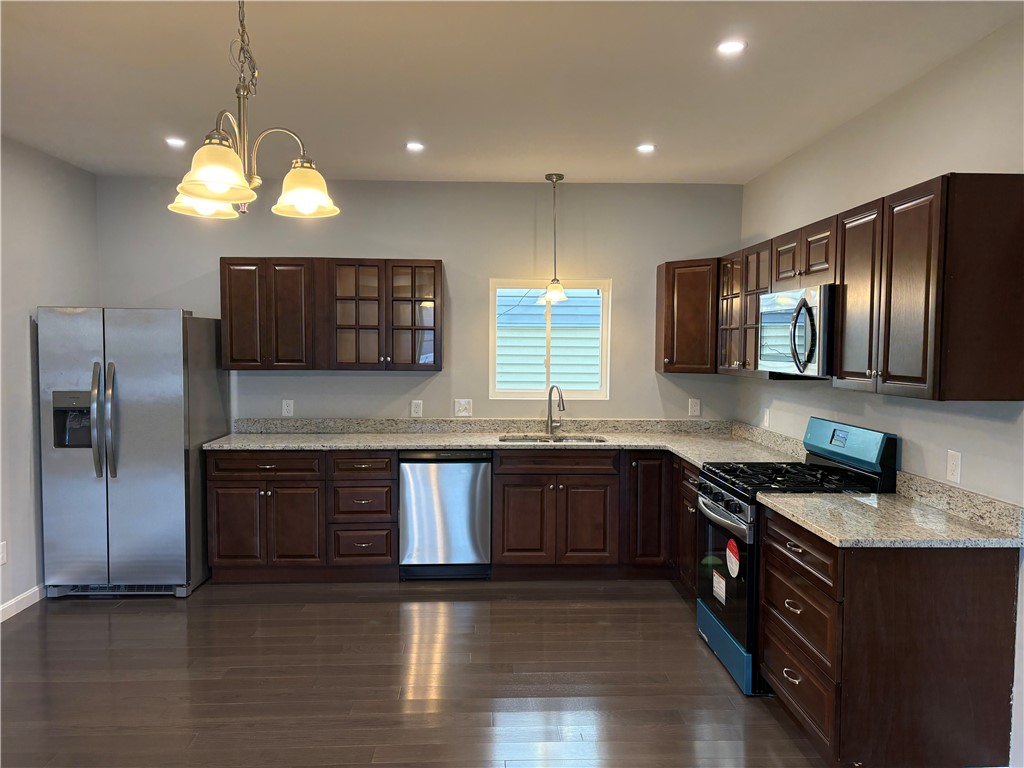 184 Avenue C, Unit M2 Woonsocket, RI 02895 - Photo 3 of 11 Beautiful kitchen featuring granite countertops and Stainless-Steel Appliances.