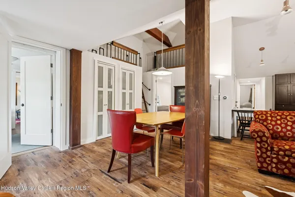 a view of a livingroom with furniture and wooden floor