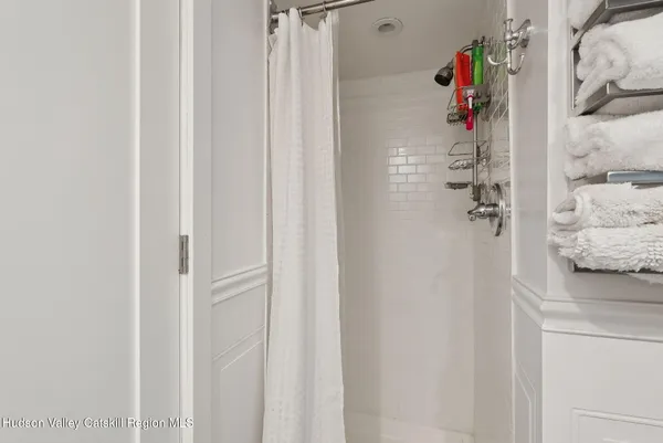 a bathroom with a shower and a sink