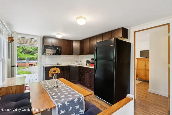a kitchen with stainless steel appliances granite countertop a refrigerator and a stove
