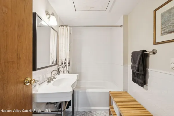 a bedroom with a bed and flat screen tv