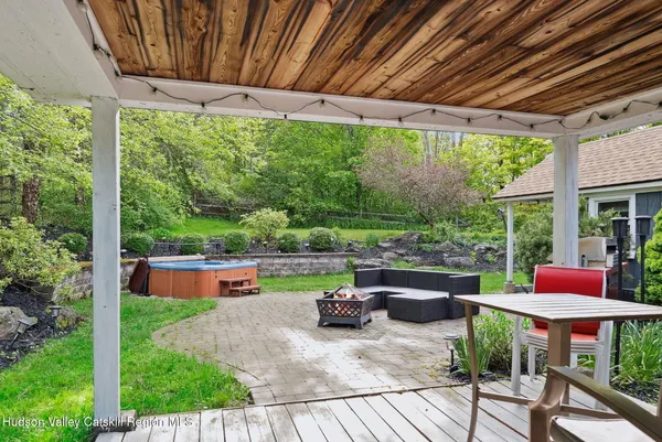 a view of a backyard with swimming pool
