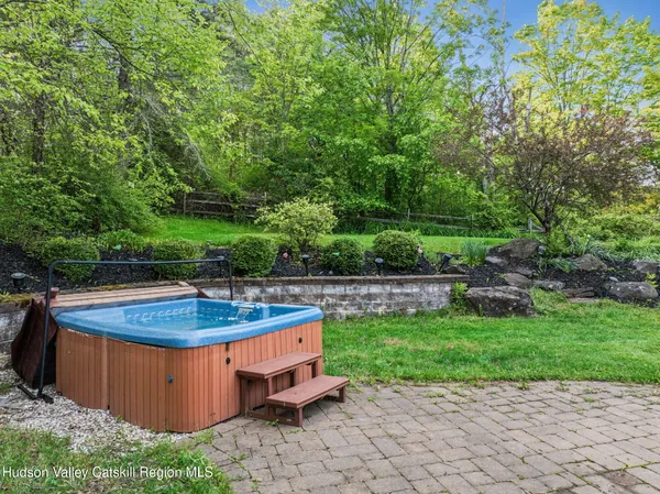 a view of a garden with large trees
