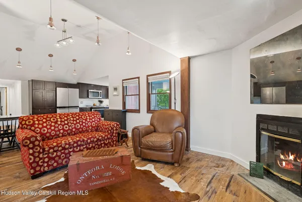 a bed room with furniture and a fireplace