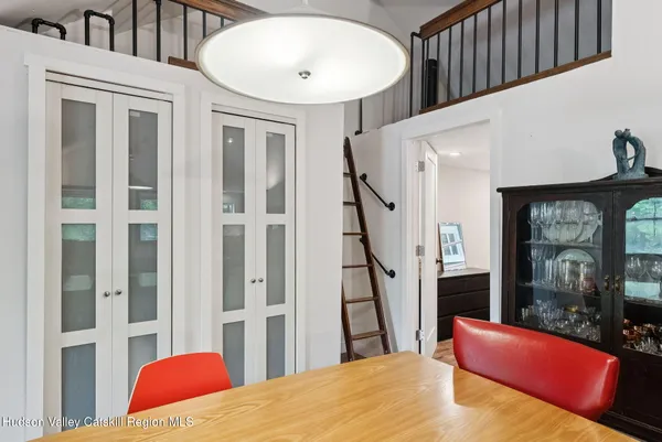 a view of a livingroom with furniture and staircase