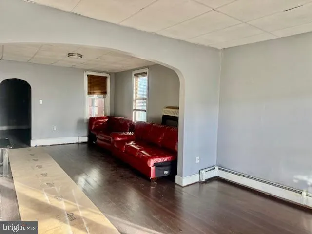 a living room with a couch and a window